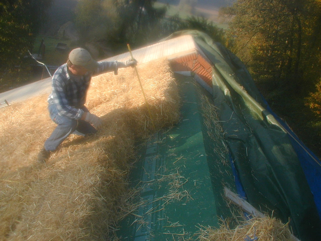 Rooftop straw bale insulation